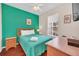 Bedroom features a wooden bed frame, a ceiling fan and a writing desk at 438 Miramar Ave, Davenport, FL 33897