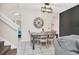 Open floor plan dining area with views of the staircase and living room at 438 Miramar Ave, Davenport, FL 33897