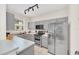 Functional kitchen with modern stainless steel appliances and gray cabinets at 438 Miramar Ave, Davenport, FL 33897