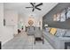 Open-concept living room with a view of the dining area and modern decor at 438 Miramar Ave, Davenport, FL 33897