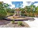 Fun playground with slide and play equipment, set amongst palm trees and landscaping at 438 Miramar Ave, Davenport, FL 33897