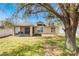 Enjoy this home's spacious backyard with a screened lanai and privacy fence at 442 Jessamine Dr, Davenport, FL 33837