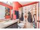 Quaint bathroom with unique astrology decor and tiled countertops at 442 Jessamine Dr, Davenport, FL 33837