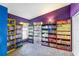 Brightly colored bedroom with built-in bookshelves and a large window at 442 Jessamine Dr, Davenport, FL 33837