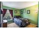 Green bedroom with one window and matching dark decor at 442 Jessamine Dr, Davenport, FL 33837