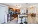Stylish kitchen with a breakfast bar, stainless steel appliances, and wood cabinets at 442 Jessamine Dr, Davenport, FL 33837