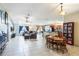 Open-concept living room and dining area, featuring tile floors and modern lighting at 442 Jessamine Dr, Davenport, FL 33837