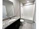 The bathroom is equipped with vanity with solid surface counter and tiled shower-tub combo at 464 Patricia Alford Dr, Haines City, FL 33844