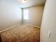 This carpeted bedroom features a window allowing natural light at 464 Patricia Alford Dr, Haines City, FL 33844
