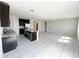 Open concept kitchen featuring a large island and dark cabinets at 464 Patricia Alford Dr, Haines City, FL 33844