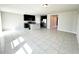 Open-concept kitchen featuring dark cabinetry, stainless steel appliances, and a granite island at 464 Patricia Alford Dr, Haines City, FL 33844