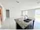 Open living room area with tile flooring and abundant natural light at 464 Patricia Alford Dr, Haines City, FL 33844