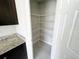 Pantry features ample storage with multiple rows of wire shelving at 464 Patricia Alford Dr, Haines City, FL 33844