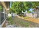 Spacious backyard featuring an outbuilding, mature trees, and plenty of space for recreation and relaxation at 5202 Greenway Drive, Orlando, FL 32819