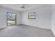 This bedroom features neutral carpet and large windows at 5202 Greenway Drive, Orlando, FL 32819