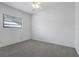 Clean bedroom with carpeting and a window offering natural light at 5202 Greenway Drive, Orlando, FL 32819