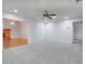 Neutral living area with carpet, ceiling fan, fireplace and view to hallway at 5202 Greenway Drive, Orlando, FL 32819
