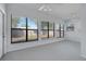 Bright sunroom features large windows that offer abundant natural light and views of the outdoor space at 5202 Greenway Drive, Orlando, FL 32819