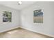 Bedroom with vinyl floors featuring two windows with lots of light at 5215 Ashwood Pl, Orlando, FL 32808