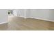 Spacious and bright living room with natural light and light wood-look flooring at 5215 Ashwood Pl, Orlando, FL 32808