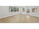Open-concept space with luxury vinyl flooring, natural light, and neutral tones at 5215 Ashwood Pl, Orlando, FL 32808