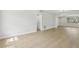 Bright, open-concept living area with luxury vinyl flooring and natural light at 5215 Ashwood Pl, Orlando, FL 32808