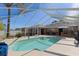 Large screened-in pool and outdoor kitchen make this backyard an entertainer's dream at 5347 Pecan Rd, Ocala, FL 34472