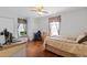 Bedroom with wood floors, closet, and roll-in wheelchair at 5347 Pecan Rd, Ocala, FL 34472