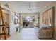 Inviting sunroom with tile flooring and sliding glass doors that lead to an outdoor patio for relaxing and entertaining at 5347 Pecan Rd, Ocala, FL 34472