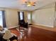 Bright living room with hardwood floors, ceiling fan, and comfortable seating arrangement at 5347 Pecan Rd, Ocala, FL 34472