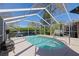 Sparkling screened-in pool area provides a private oasis for relaxation and recreation in a lush, tropical setting at 5347 Pecan Rd, Ocala, FL 34472