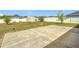 Large backyard with a patio, a wooden shed and a white vinyl fence at 5361 Se 92Nd St, Ocala, FL 34480