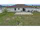 Wide view of the yard shows lawn, patio, and border fencing at 5361 Se 92Nd St, Ocala, FL 34480