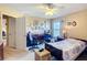 Bright bedroom with a ceiling fan, a view of a lake, and home office at 5361 Se 92Nd St, Ocala, FL 34480