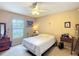 Comfortable bedroom with bright natural light, a ceiling fan, and a calm relaxing ambiance at 5361 Se 92Nd St, Ocala, FL 34480