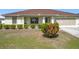 Charming single-story home with a well-maintained lawn and a two-car garage at 5361 Se 92Nd St, Ocala, FL 34480