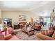 Spacious living room with high ceilings, comfortable seating, and a seamless flow to the dining area at 5361 Se 92Nd St, Ocala, FL 34480