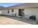 Back patio features a sliding glass door, seating, and a bright, neutral color scheme at 5361 Se 92Nd St, Ocala, FL 34480