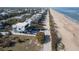 Coastal home situated on the beach offering a private deck with ocean views at 6480 S Atlantic Ave, New Smyrna Beach, FL 32169