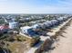 Beachfront property featuring multi-level decks, a private pool, and lush landscaping at 6480 S Atlantic Ave, New Smyrna Beach, FL 32169