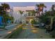 Beautiful backyard with a pool, sundeck and lovely landscaping creating a private oasis at 6480 S Atlantic Ave, New Smyrna Beach, FL 32169