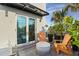 Inviting balcony with comfortable seating, lush greenery, and views of the ocean at 6480 S Atlantic Ave, New Smyrna Beach, FL 32169