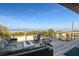 Relaxing outdoor balcony showcasing comfortable seating and a stunning view of the ocean at 6480 S Atlantic Ave, New Smyrna Beach, FL 32169
