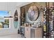 Stylish bar area featuring a custom wine rack, beverage cooler, and unique surfboard art at 6480 S Atlantic Ave, New Smyrna Beach, FL 32169