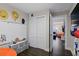 Bright bedroom leading to the main living area, featuring a closet and a fun orange beanbag chair at 6480 S Atlantic Ave, New Smyrna Beach, FL 32169