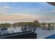 Oceanfront deck with glass railings, comfortable seating and stunning water views at 6480 S Atlantic Ave, New Smyrna Beach, FL 32169