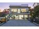 Modern two-story home featuring a beautiful patio and balcony, perfect for outdoor living at 6480 S Atlantic Ave, New Smyrna Beach, FL 32169