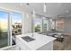 Modern kitchen seamlessly flows into an open-plan living area with ample natural light at 6480 S Atlantic Ave, New Smyrna Beach, FL 32169