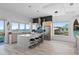 Open kitchen features modern island, sleek appliances, and stunning ocean views at 6480 S Atlantic Ave, New Smyrna Beach, FL 32169