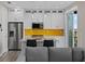 Modern kitchen featuring a stylish island, stainless steel appliances, and bright backsplash at 6480 S Atlantic Ave, New Smyrna Beach, FL 32169